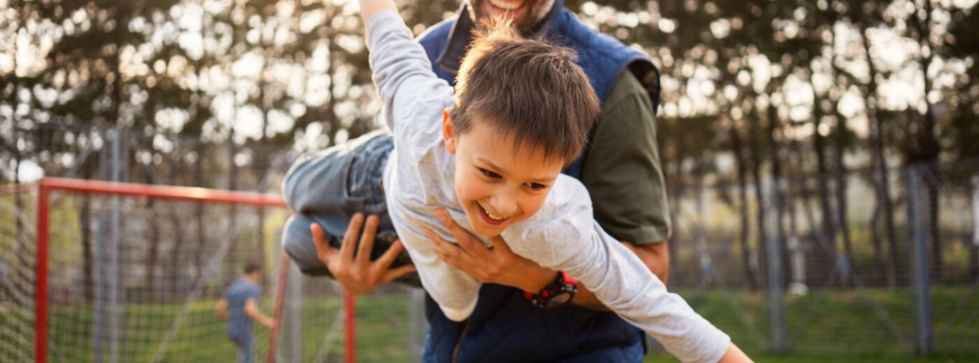 Father and son playing outside